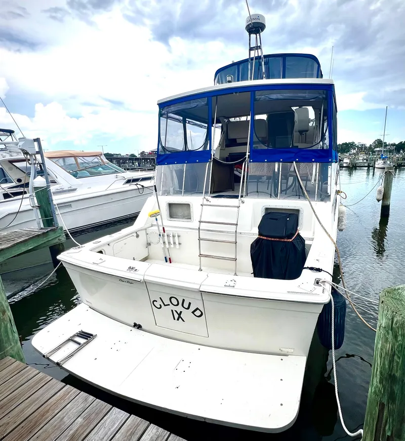 Slide: The Image of 1986 Chris-Craft 480 Corinthian boat docked at marina, rear view. - 5