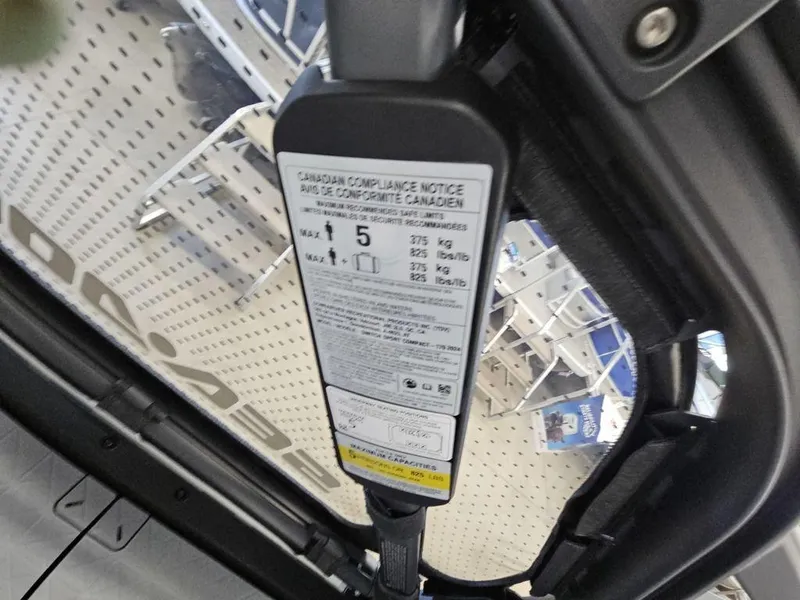 Slide: The Image of 2024 Sea-Doo Switch® Sport Compact compliance notice with weight and capacity details. - 11