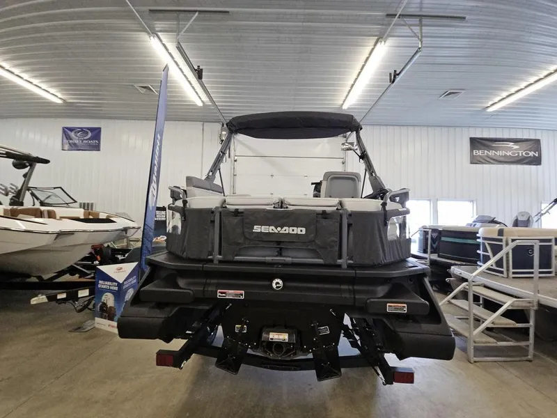 Slide: The Image of 2024 Sea-Doo Switch Sport Compact 170 hp displayed in a showroom, rear view. - 12