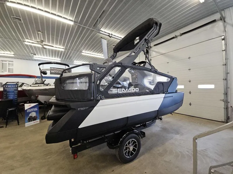 Slide: The Image of 2024 Sea-Doo Switch® Sport Compact 170 hp boat displayed indoors on a trailer. - 3