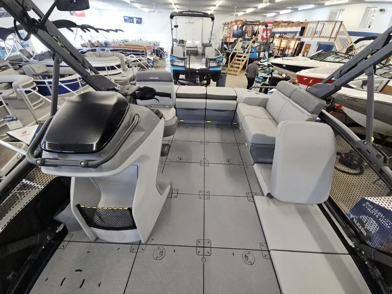 Slide: The Image of 2024 Sea-Doo Switch® Sport Compact interior with seating and helm in showroom. - 4