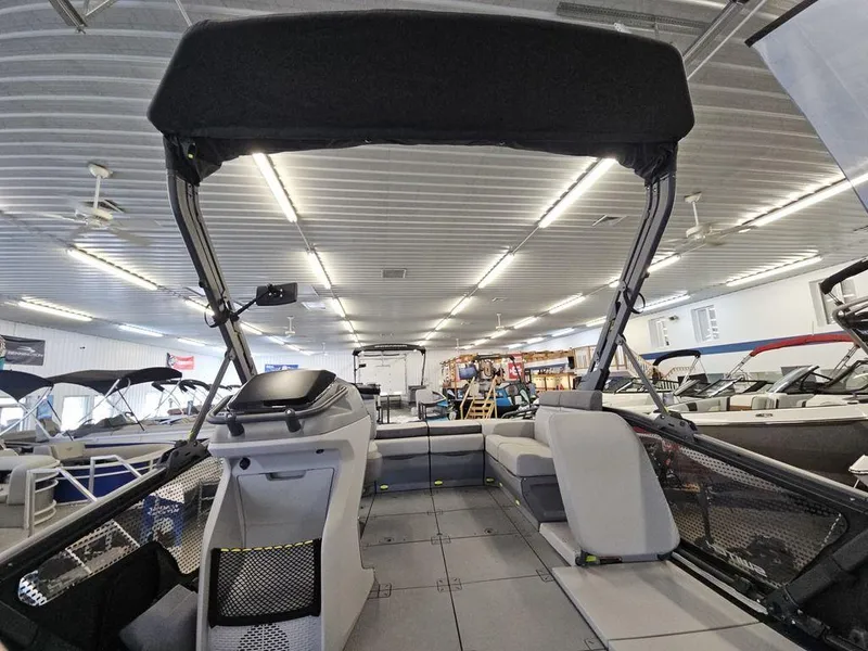 Slide: The Image of 2024 Sea-Doo Switch® Sport Compact - 170 hp interior in showroom, featuring modern design and seating. - 7