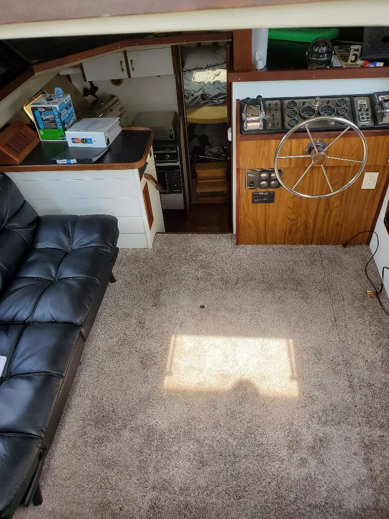 Slide: The Image of Interior of 1983 Carver 3207 AFT Cabin Motor Yacht with helm and seating area. - 10