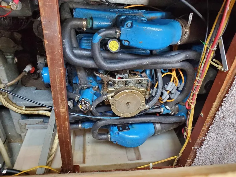 Slide: The Image of Engine of 1983 Carver 3207 AFT Cabin Motor Yacht, featuring blue components and wiring. - 2