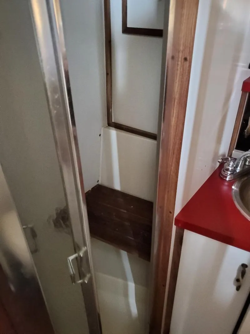 Slide: The Image of Shower area in 1983 Carver 3207 AFT Cabin Motor Yacht with wooden accents. - 6