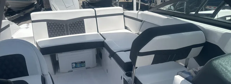 Slide: The Image of 2025 Monterey M-205 boat interior with white and black seating arrangement. - 11