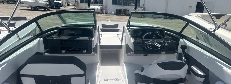 Slide: The Image of 2025 Monterey M-205 boat interior with modern dashboard and seating. - 15