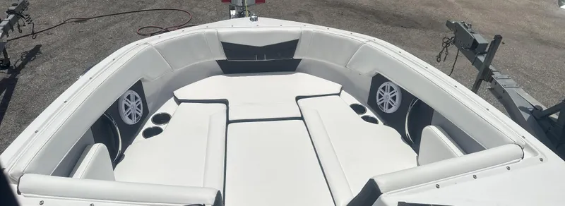 Slide: The Image of 2025 Monterey M-205 boat interior with white seating and speakers. - 18