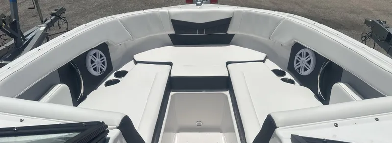 Slide: The Image of 2025 Monterey M-205 boat interior with white seating and built-in speakers. - 20