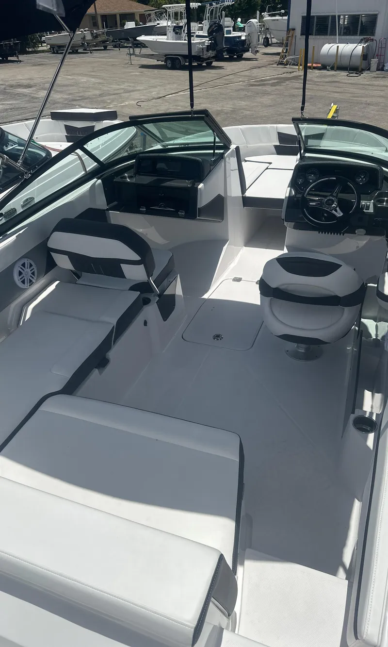 Slide: The Image of 2025 Monterey M-205 boat interior with sleek seating and modern dashboard. - 9