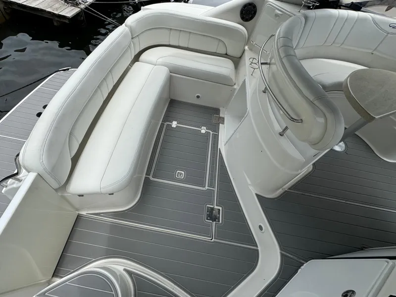 Slide: The Image of 2003 Regal Commodore 3860 boat interior with white seating and gray flooring. - 11