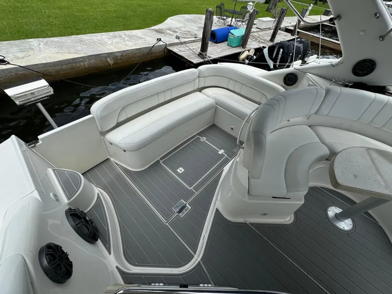 Slide: The Image of 2003 Regal Commodore 3860 boat interior with white seating and gray flooring. - 12