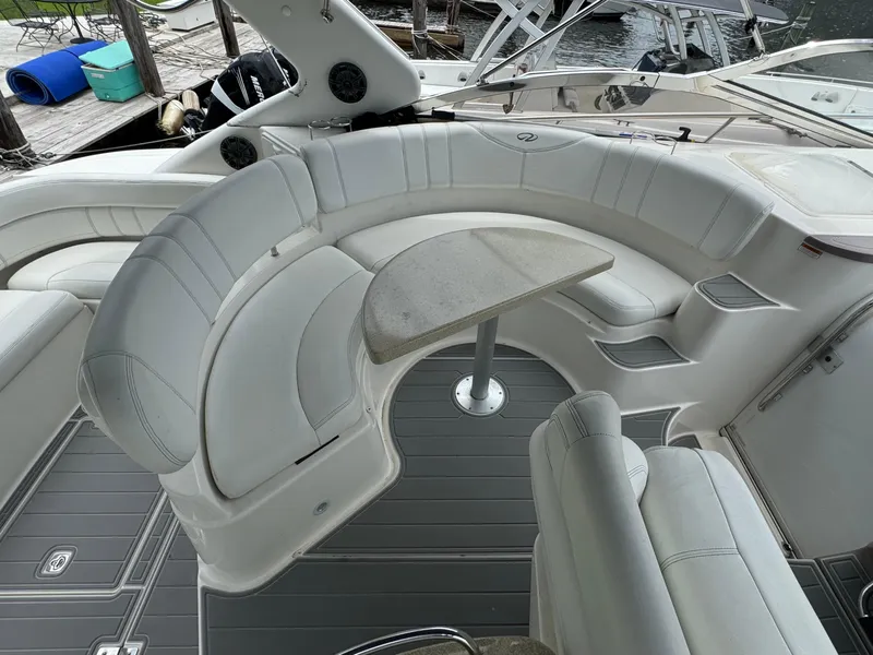 Slide: The Image of 2003 Regal Commodore 3860 yacht interior with curved seating and table. - 13