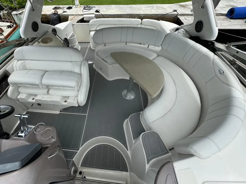 Slide: The Image of 2003 Regal Commodore 3860 boat interior with white leather seating and table. - 16