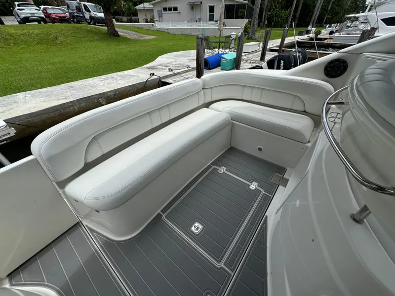 Slide: The Image of 2003 Regal Commodore 3860 boat interior with white seating and gray flooring. - 18