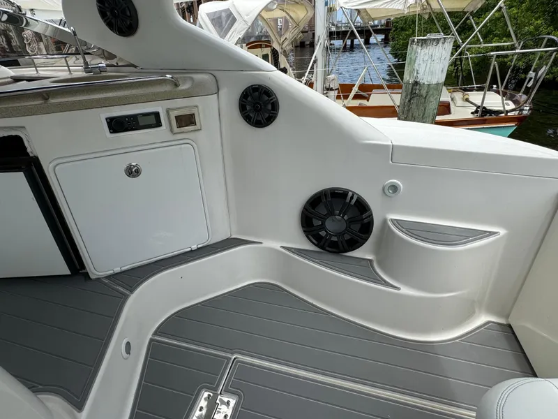 Slide: The Image of 2003 Regal Commodore 3860 boat interior with speakers and storage compartments. - 19