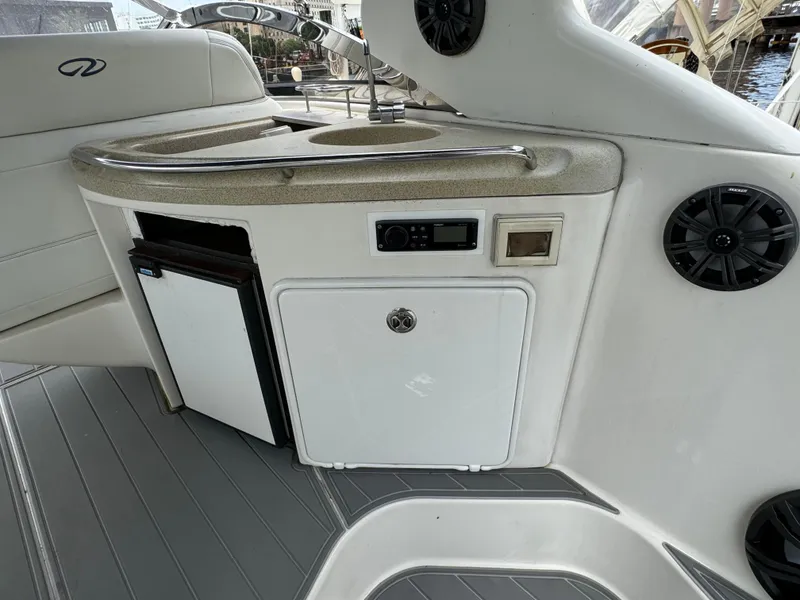 Slide: The Image of 2003 Regal Commodore 3860 yacht interior with mini fridge and control panel. - 20