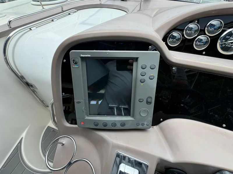 Slide: The Image of 2003 Regal Commodore 3860 dashboard with navigation system and gauges. - 27