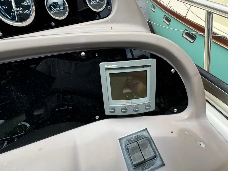 Slide: The Image of 2003 Regal Commodore 3860 dashboard with Raymarine display and controls. - 28