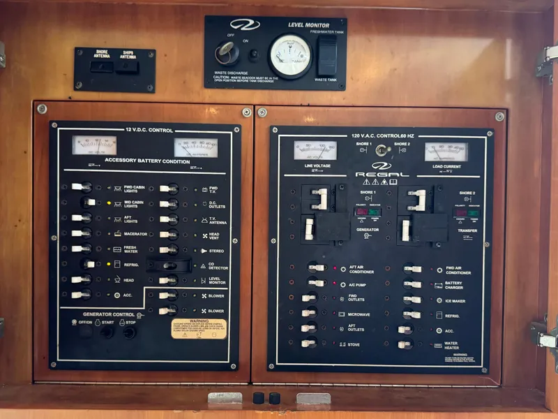 Slide: The Image of Electrical control panel of a 2003 Regal Commodore 3860 boat. - 36