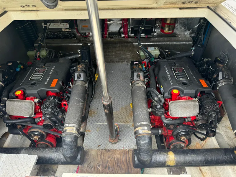Slide: The Image of Twin engines in a 2003 Regal Commodore 3860 boat engine room. - 37