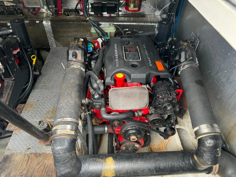 Slide: The Image of Engine compartment of a 2003 Regal Commodore 3860 boat, featuring a Volvo Penta engine. - 38