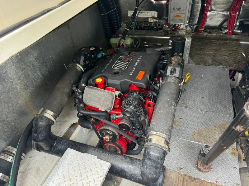Slide: The Image of Engine compartment of 2003 Regal Commodore 3860 boat, featuring a well-maintained motor. - 39