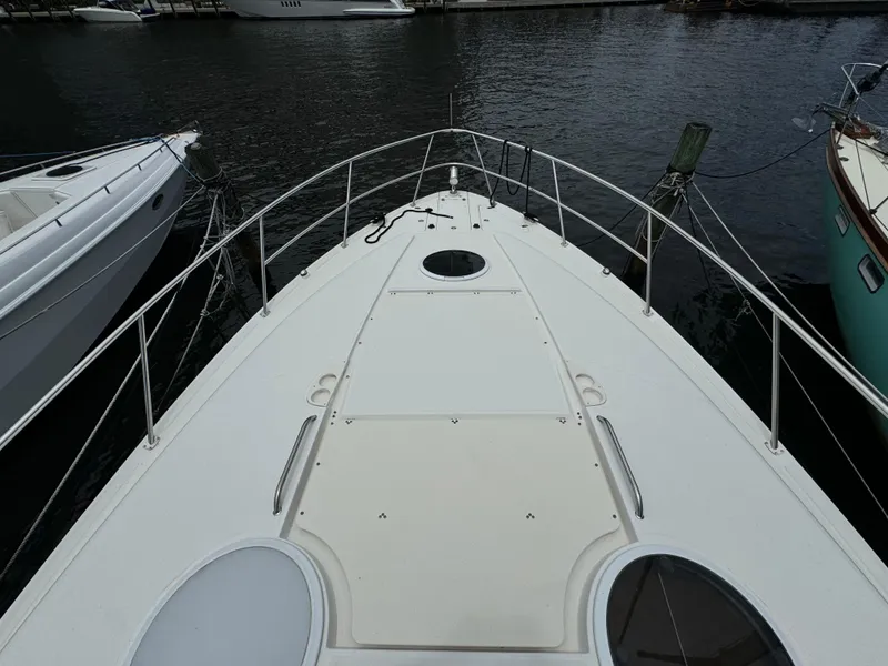 Slide: The Image of 2003 Regal Commodore 3860 yacht bow view at marina. - 42