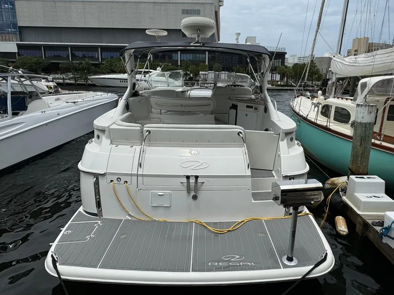 Slide: The Image of 2003 Regal Commodore 3860 yacht docked at marina, rear view. - 6