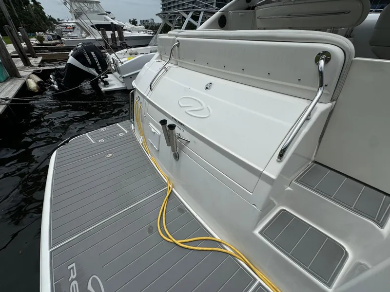 Slide: The Image of 2003 Regal Commodore 3860 yacht docked, featuring sleek design and modern amenities. - 9