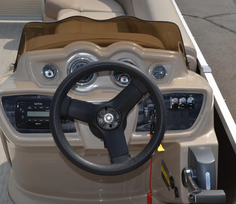 Slide: The Image of 2018 Tahoe LTZ 2285 CR pontoon boat with Evinrude motor, docked in a marina. - 11