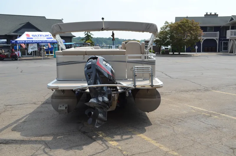 Slide: The Image of 2018 Tahoe LTZ 2285 CR pontoon boat with outboard motor in parking lot. - 4
