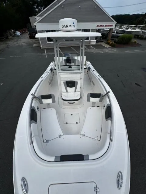 Slide: The Image of 2022 Robalo R230 Center Console boat with Garmin equipment, docked at a marina. - 14