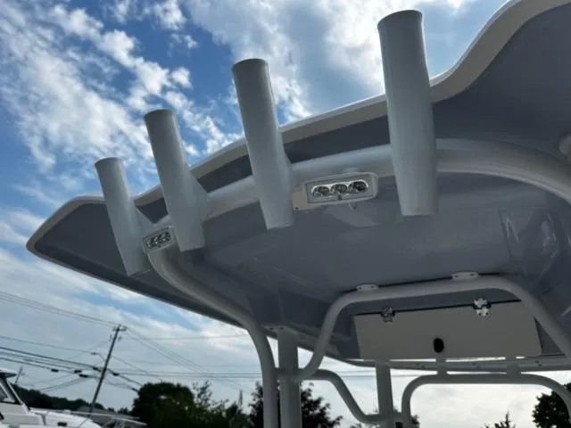 Slide: The Image of 2022 Robalo R230 Center Console boat top with rod holders and LED lights. - 15