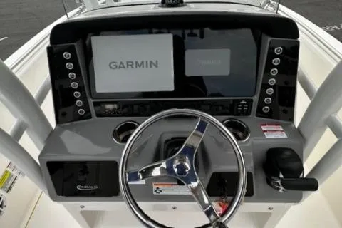 Slide: The Image of 2022 Robalo R230 Center Console dashboard with Garmin navigation system. - 17