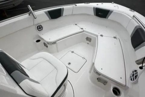 Slide: The Image of 2022 Robalo R230 Center Console boat interior with white seating and storage compartments. - 21