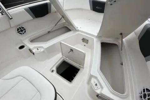 Slide: The Image of 2022 Robalo R230 Center Console boat storage compartments open. - 22