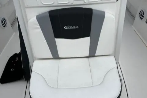 Slide: The Image of 2022 Robalo R230 Center Console boat seat with logo, white and gray upholstery. - 25