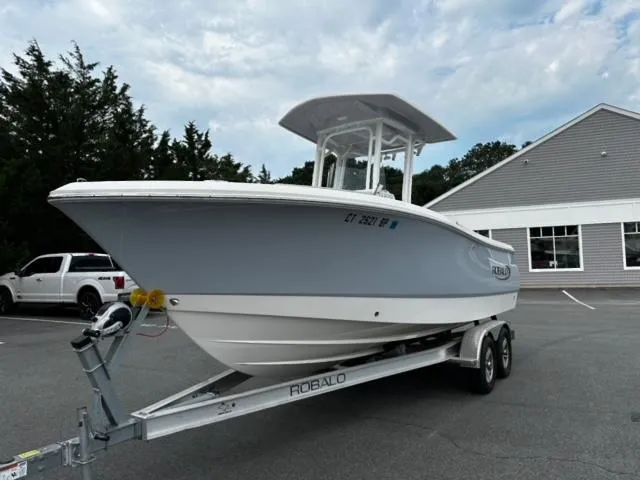 Slide: The Image of 2022 Robalo R230 Center Console boat on trailer in parking lot. - 4