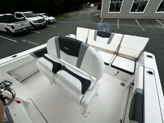 Slide: The Image of 2022 Robalo R230 Center Console boat interior with seating and steering wheel. - 9