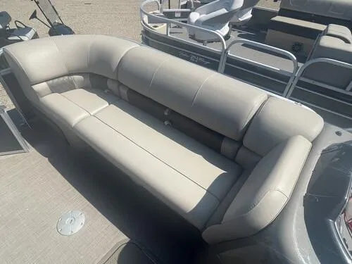 Slide: The Image of 2022 Sun Tracker Party Barge 22 XP3 with beige seating and spacious deck layout. - 10