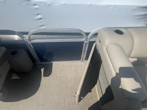 Slide: The Image of Interior of 2022 Sun Tracker Party Barge 22 XP3, featuring beige seating and flooring. - 11