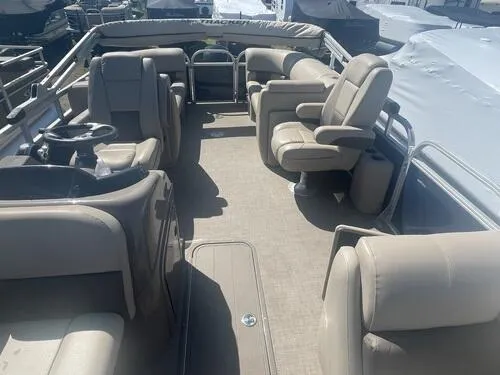 Slide: The Image of 2022 Sun Tracker Party Barge 22 XP3 interior with beige seating and spacious layout. - 13