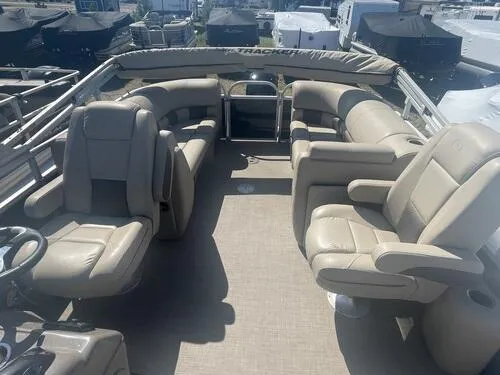 Slide: The Image of 2022 Sun Tracker Party Barge 22 XP3 interior with beige seating and spacious layout. - 6