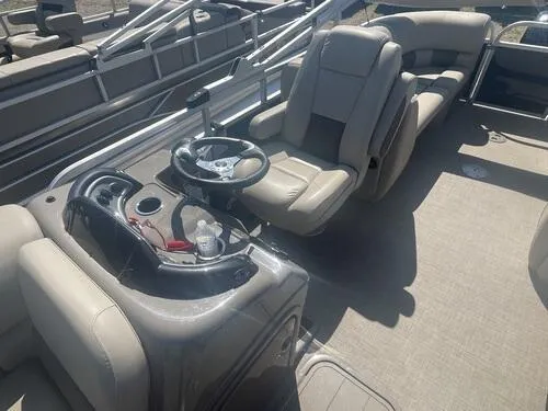 Slide: The Image of 2022 Sun Tracker Party Barge 22 XP3 interior with steering console and seating. - 7