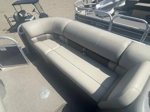 Slide: The Image of 2022 Sun Tracker Party Barge 22 XP3 with beige seating and spacious deck layout. - 9