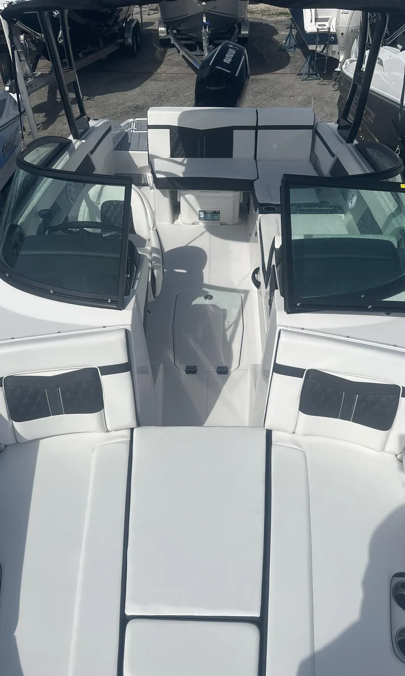 Slide: The Image of 2025 Monterey M-225 boat interior with seating and storage compartments. - 11