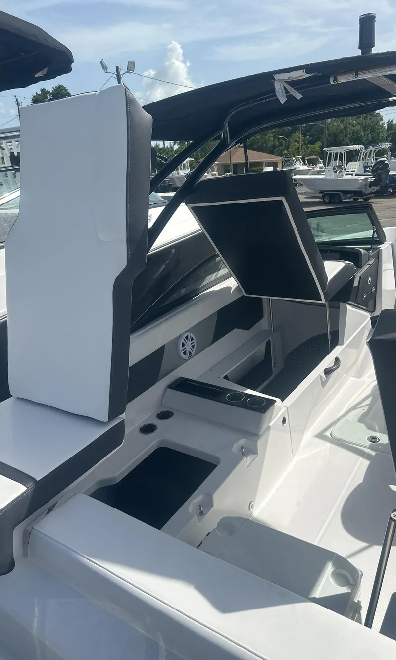 Slide: The Image of 2025 Monterey M-225 boat interior with sleek seating and modern dashboard. - 13