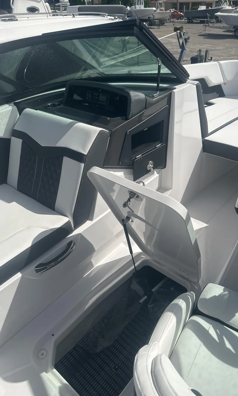 Slide: The Image of 2025 Monterey M-225 boat dashboard with modern controls and sleek design. - 17