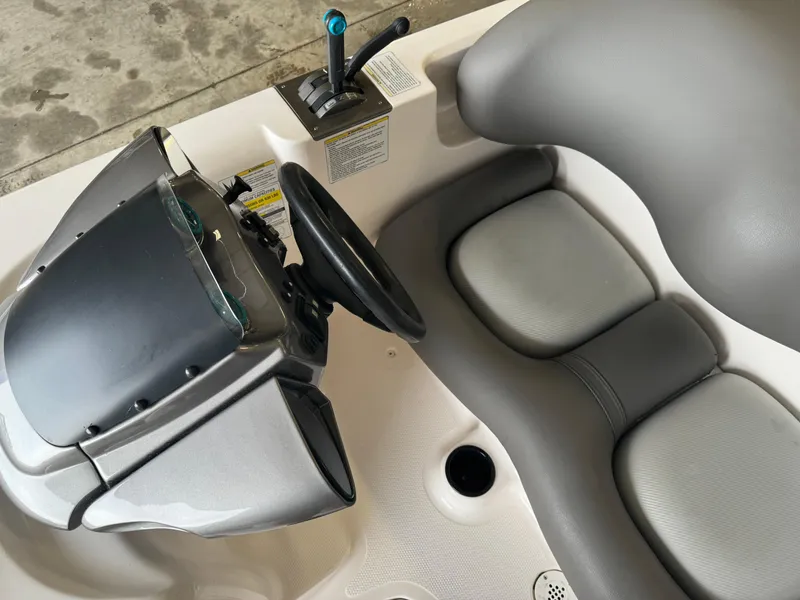 Slide: The Image of 1998 Yamaha Boats Exciter interior with steering wheel and seating. - 11